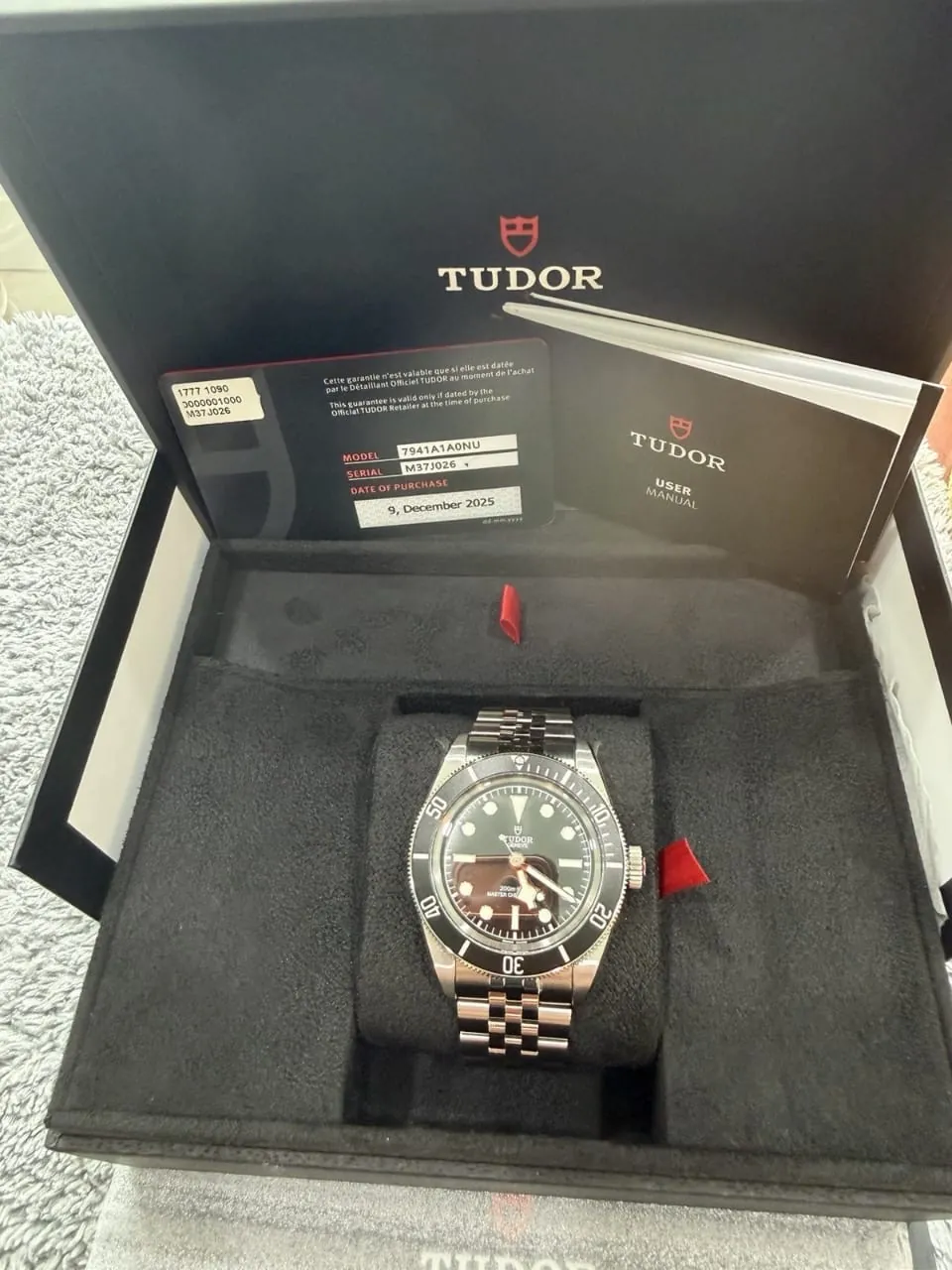 Montre pour homme TUDOR 7941A1A0NU, cadran noir, acier, étanche à 200 m, avec boîte et papiers.